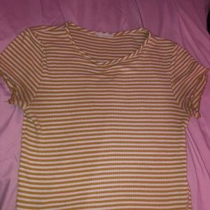 selling a yellow and white crop top